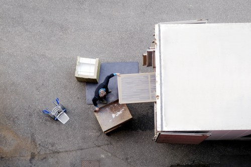 Professional movers handling office equipment in Locksbottom